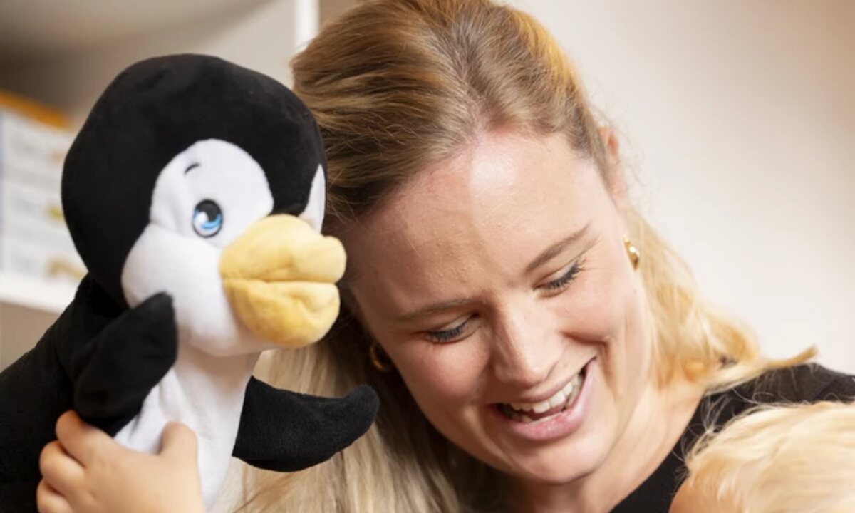Julia sharing a playful moment with a child